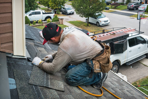 Professional Roof Replacement technician working in Bringhurst, IN